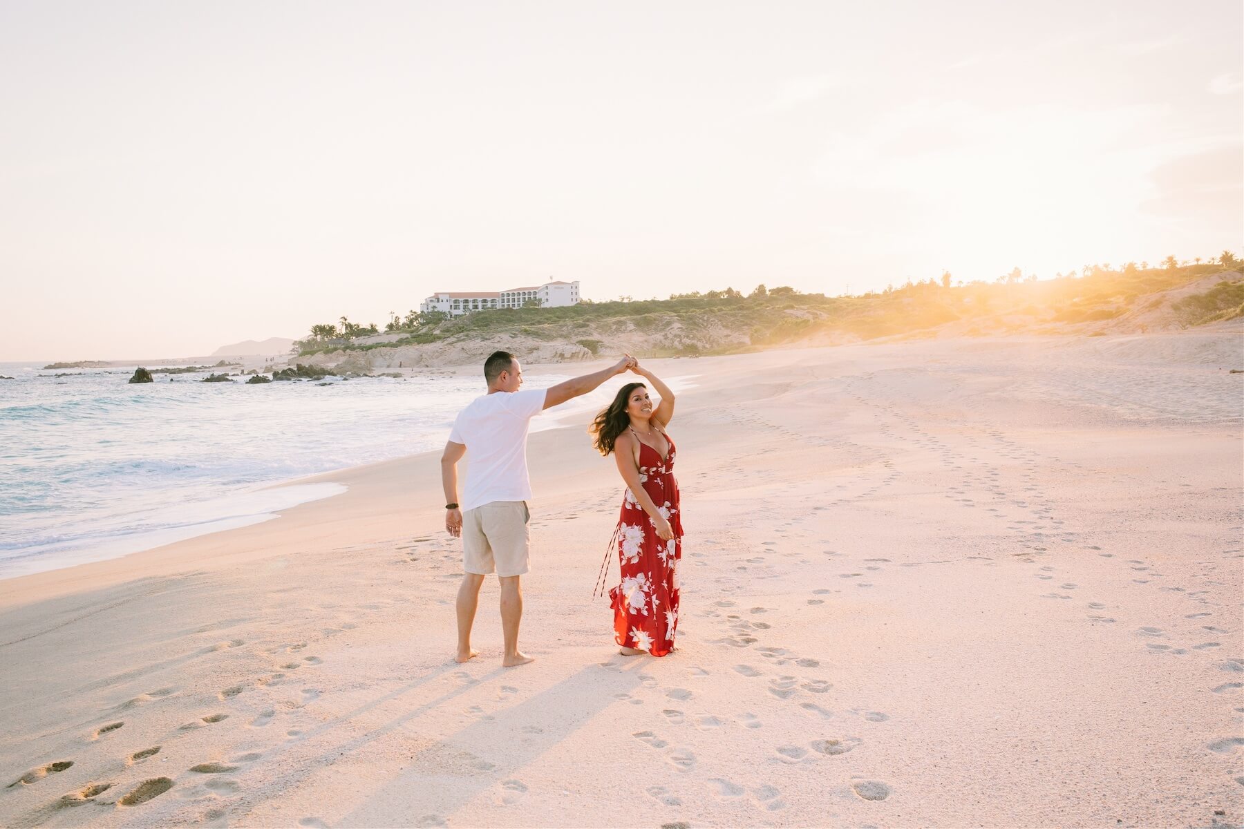 A couple dances on the beach in Cabo San Lucas at sunset