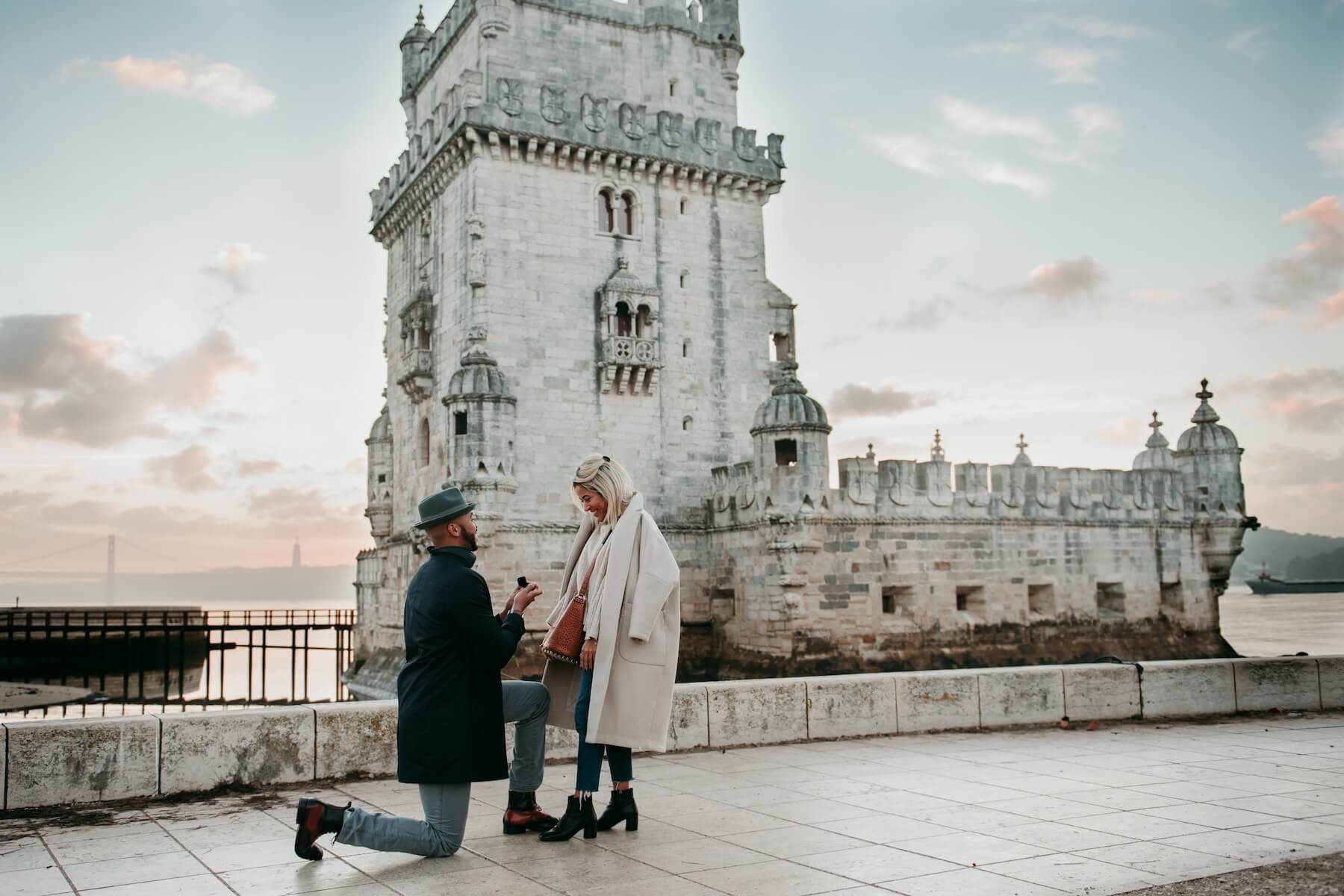 A guy proposes to his girlfriend in Lisbon, Portugal on a surprise proposal photoshoot
