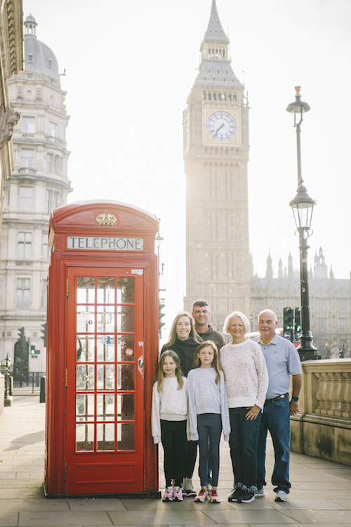 Parents, grandparents, and children pose together in a family photo in London on their Flytographer photoshoot.